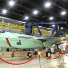 Secretary of Defense Robert M. Gates tours the Lockheed Martin F-35 Joint Strike Fighter production facility with Lockheed Martin President Robert Stevens, right, and Vice President Ralph Heath, left, in Fort Worth, TX., Aug. 31, 2009.  DOD photo by Cherie Cullen (released)