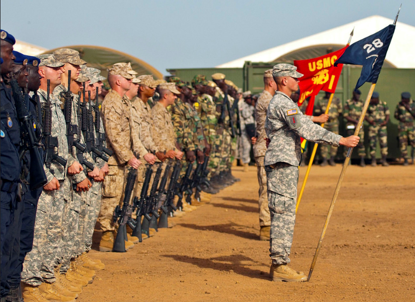 Service members from the Senegal Military Police, United States Army, United States Marines and Senegalese Paratroopers stand in formation for Exercise Western Accord opening ceremony [US Army Africa photo by by Staff Sgt. Donna Davis, 6/16/14]